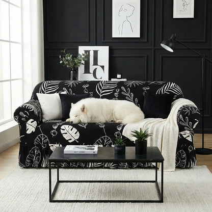 Protection-canape-chien-anti-poils-anti accident, lavable en machine, haute élasticité et resistante aux griffes et à l'usure, universelle en 4 tailles pour fauteuil, canapé de 2/3/4 places, avec élastique et bloque plis- design floral délicat- un grand chien qui dort couché confortablement sur le canapé avec sa housse extensible universelle noir dans le salon moderne et design de l'appartement